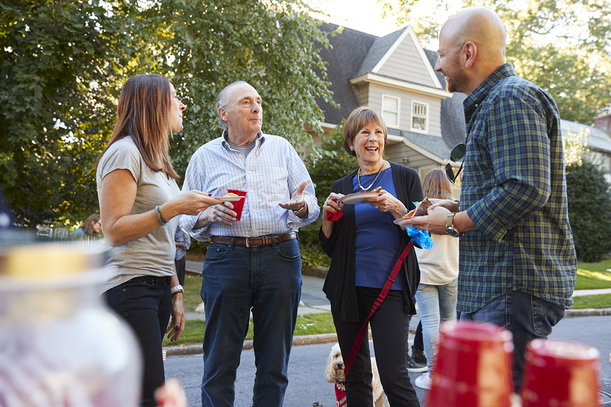 Neighbors talking at a community event