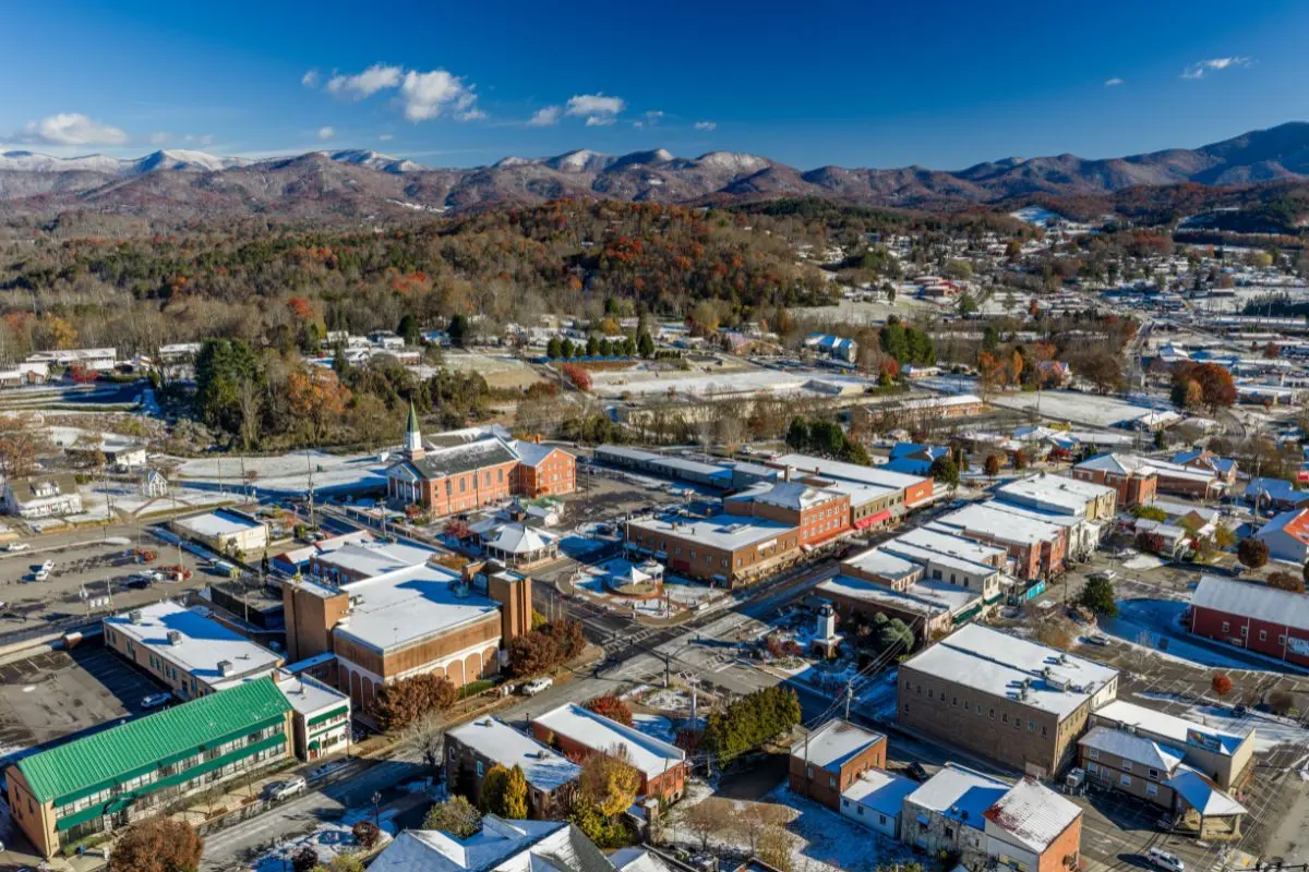Aerial view of downtown Franklin showing buildings on Main Street and the mountains in the background