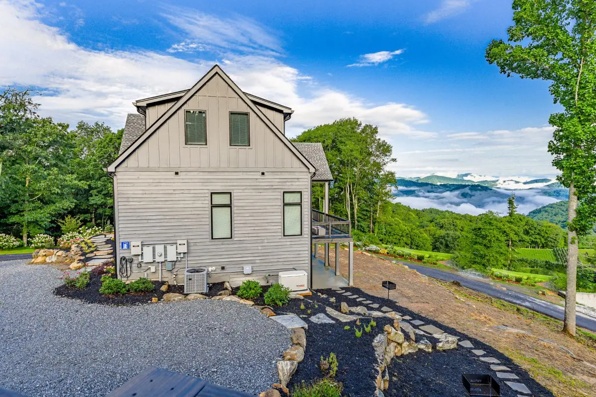 Side view of home in Highlands NC showing driveway and long range views