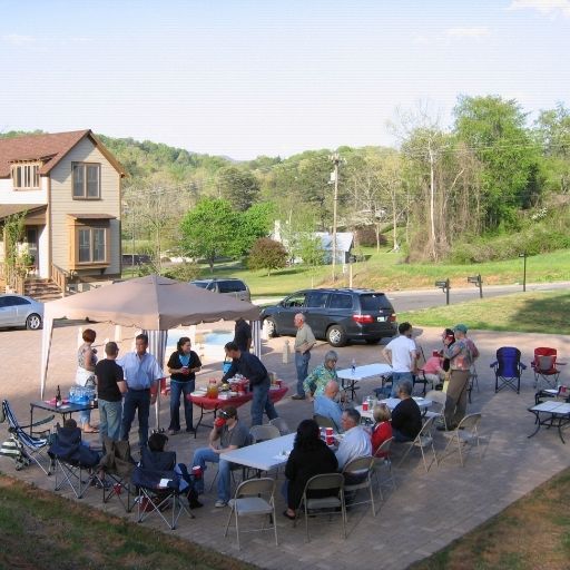 Friends gathered on plaza at Sanctuary Village for a potluck dinner