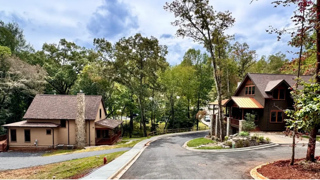 Walkable neighborhood street with homes, sidewalks and tree-lined roads designed around good urbanism and human-scale living