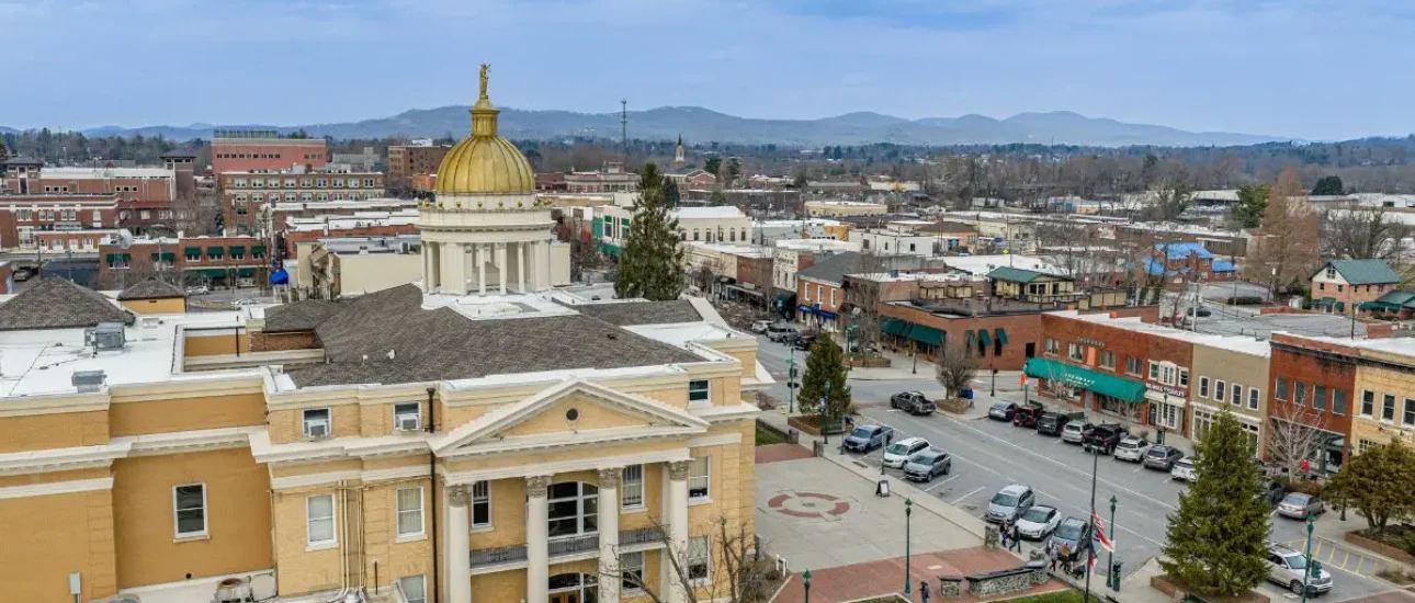 Living in Asheville, NC aerial view showing cars and buildings downtown