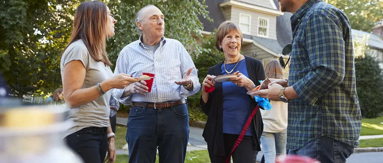 Neighbors talking at a community event