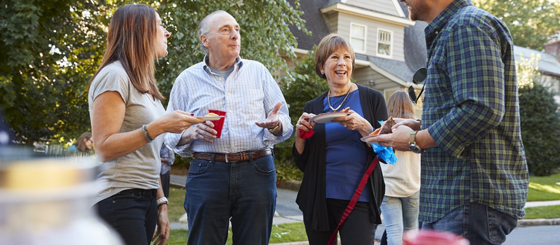 Neighbors talking at a community event